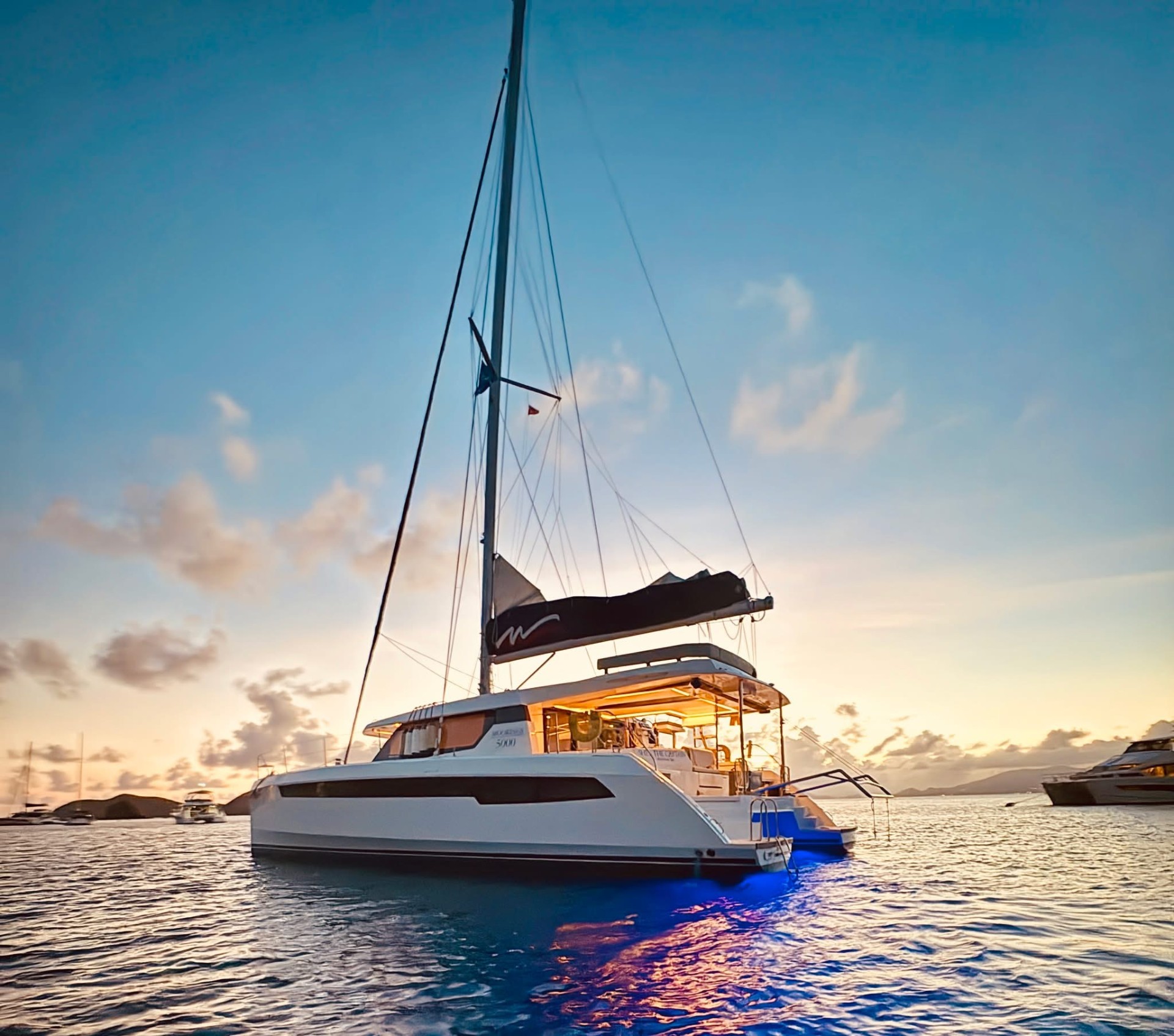 She's The Captain — 50 ft sailing catamaran at sunset in the British Virgin Islands